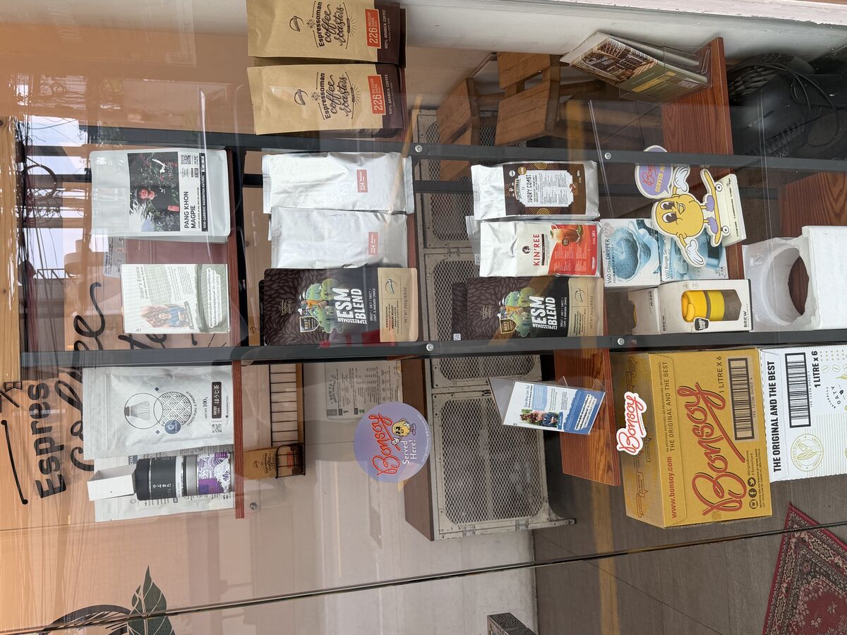 Espressoman Coffee Toasts retail shelf with specialty single origin coffee beans and Bonsoy milk on Sukhumvit Soi 49 Bangkok - premium roasts and blends for sale
