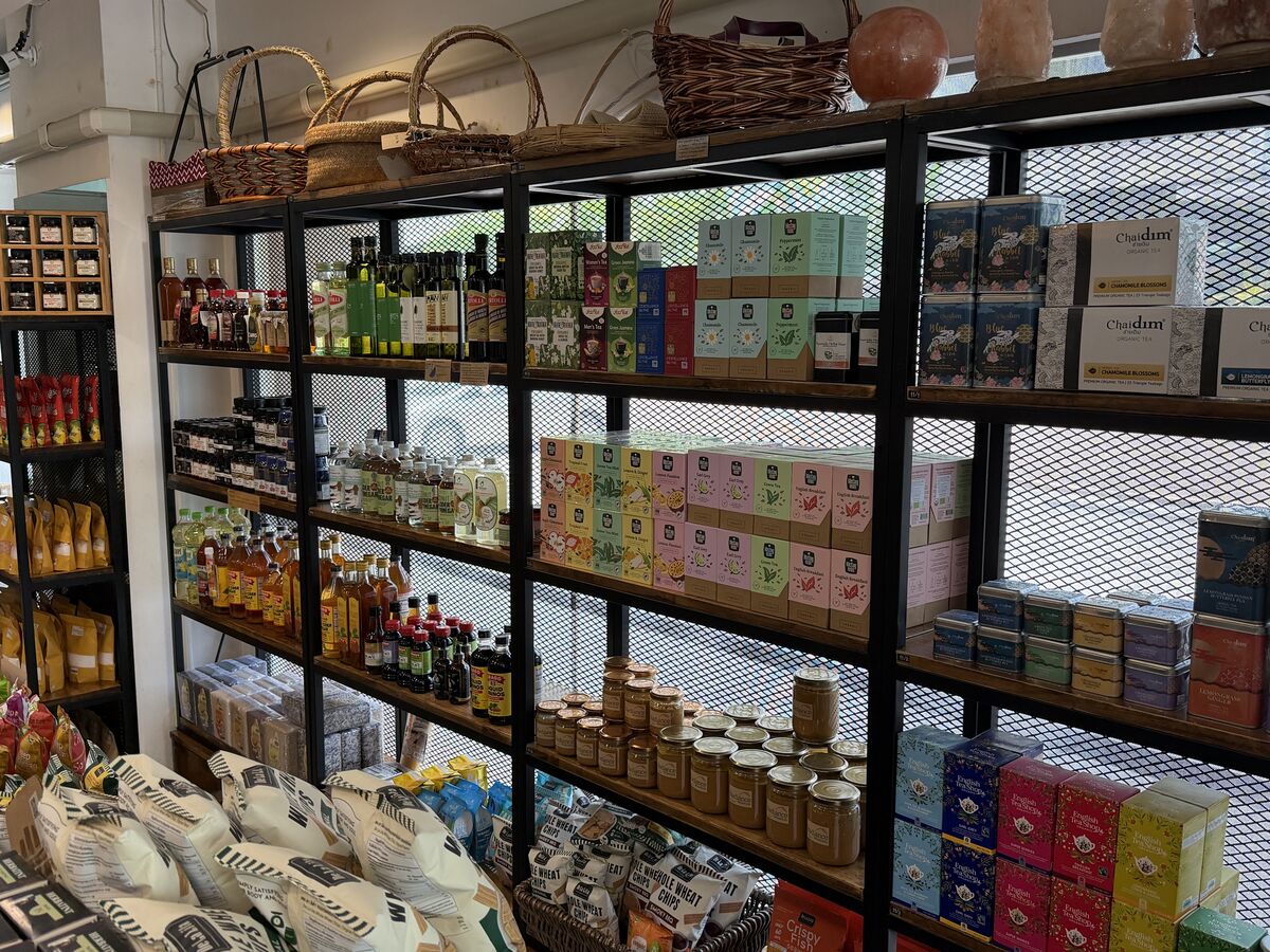 Radiance Wholefoods interior shelves stocked with certified organic teas honey sauces and superfoods on Sukhumvit Soi 49 Bangkok